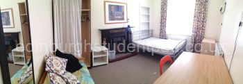 Bedroom / Lounge, with 2-seater settee, double bed, desk and wardrobe
