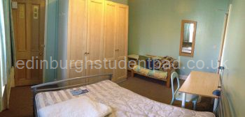 Bedroom 4 with quadruple wardrobe, double bed, 2-seater settee and desk.